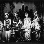 A black and white photo from the 1930s showing five Chinese Opera performers on stage